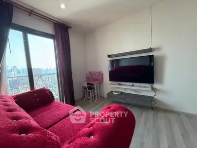 Stylish living room with red sofa and city view balcony