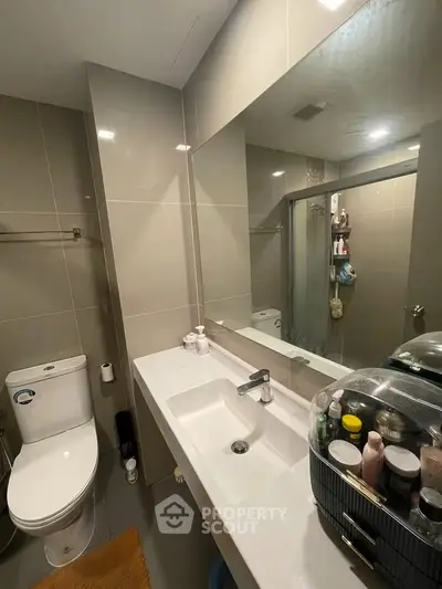 Modern bathroom with sleek fixtures and ample storage space