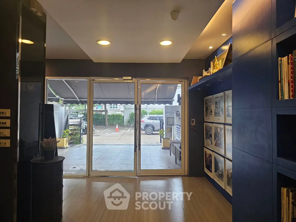 Modern entrance with glass doors and stylish interior decor