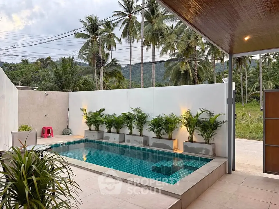 Stunning private pool area with lush greenery and mountain views, perfect for relaxation and entertaining.