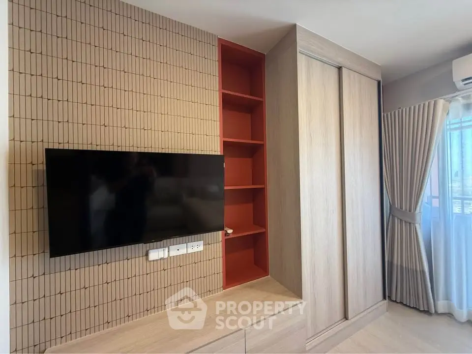 Modern living room with wall-mounted TV and stylish storage solutions