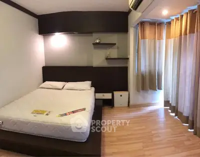 Cozy bedroom with modern design and wooden flooring