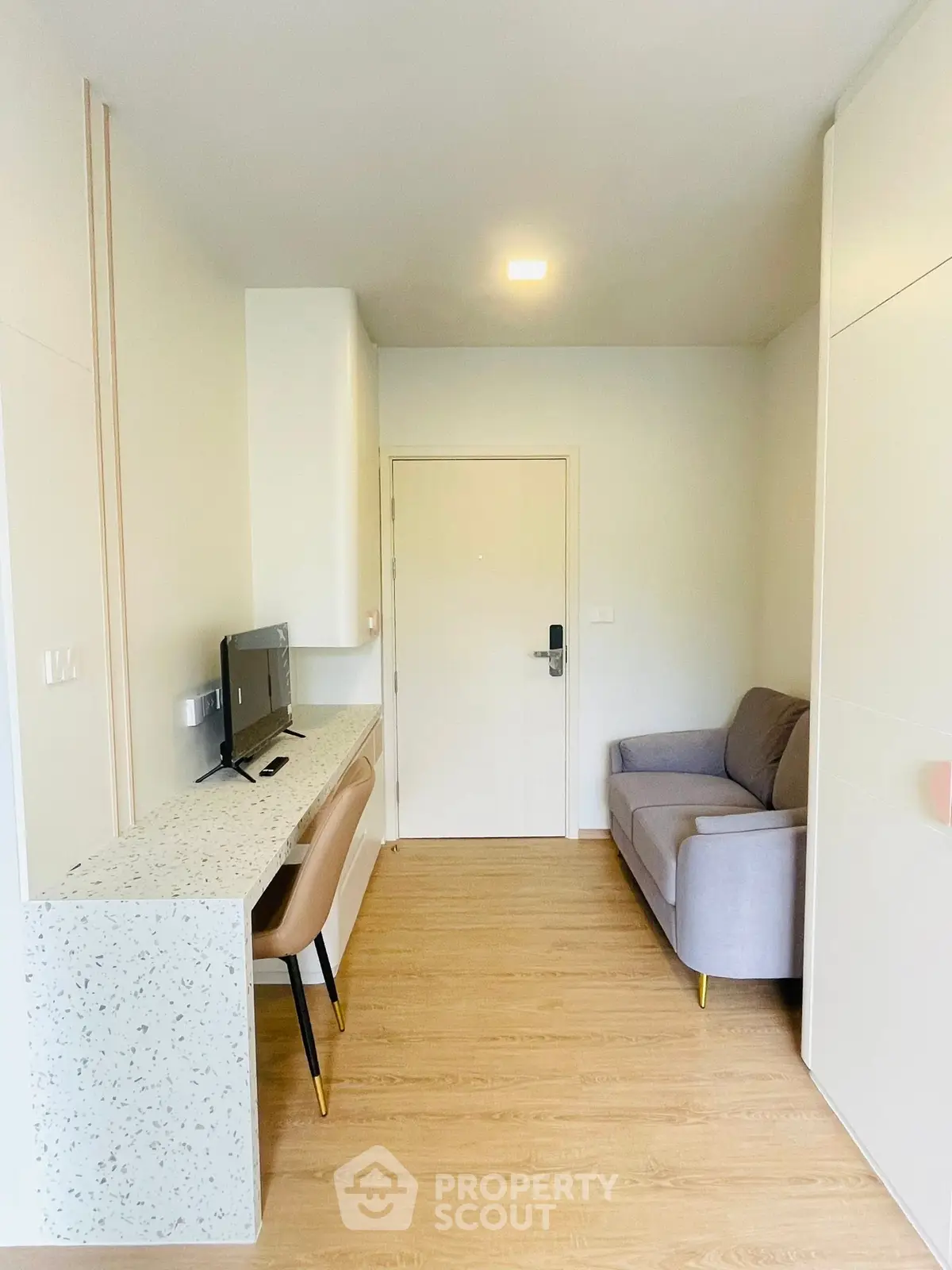 Modern compact living room with sleek furniture and minimalist design