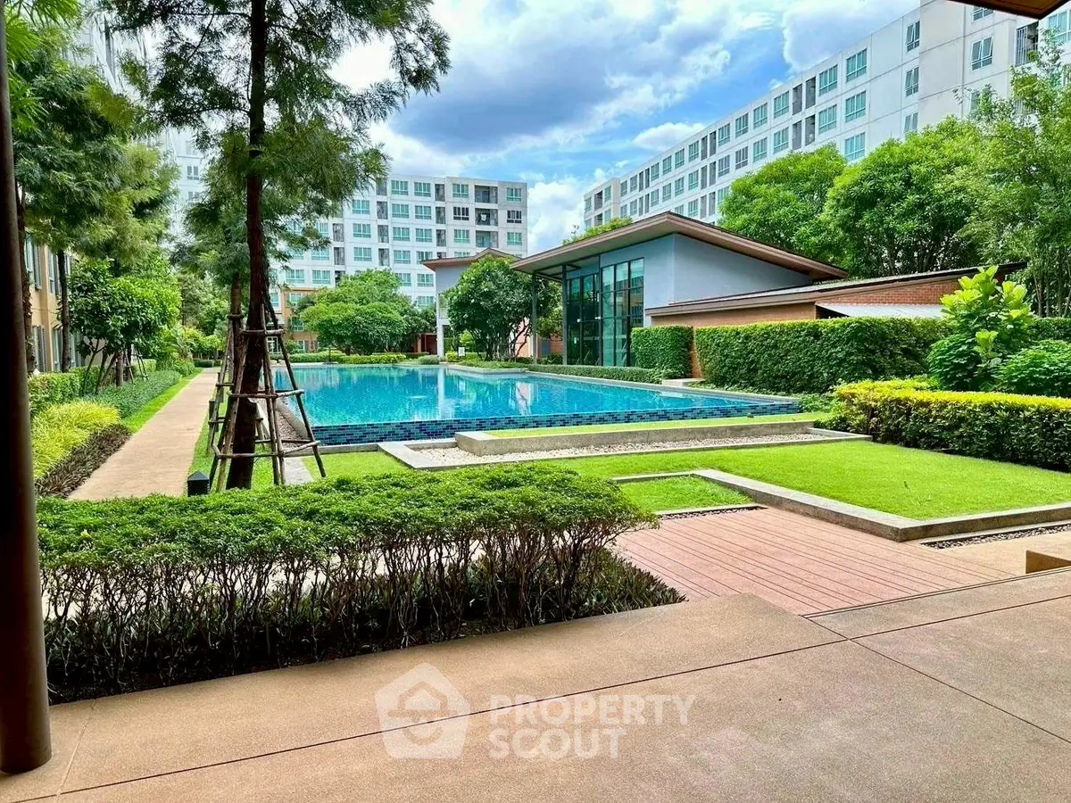 Luxurious residential complex with a stunning pool and lush greenery, perfect for relaxation and leisure.