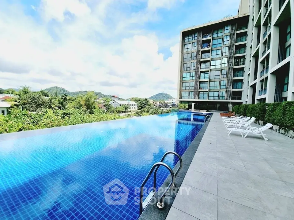 Luxurious condominium with stunning infinity pool and scenic mountain views.