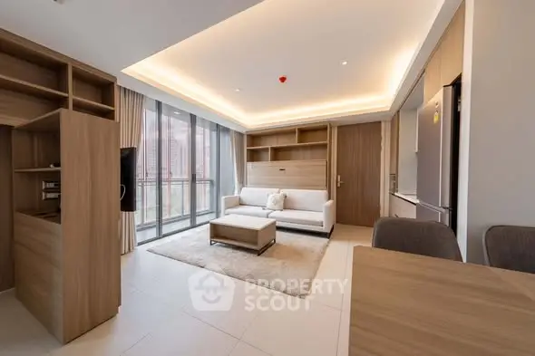 Modern living room with elegant furniture and large windows offering city views.