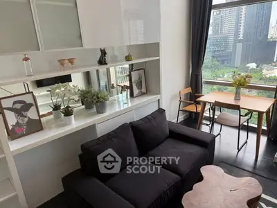 Modern living room with city view, stylish furniture, and elegant decor.