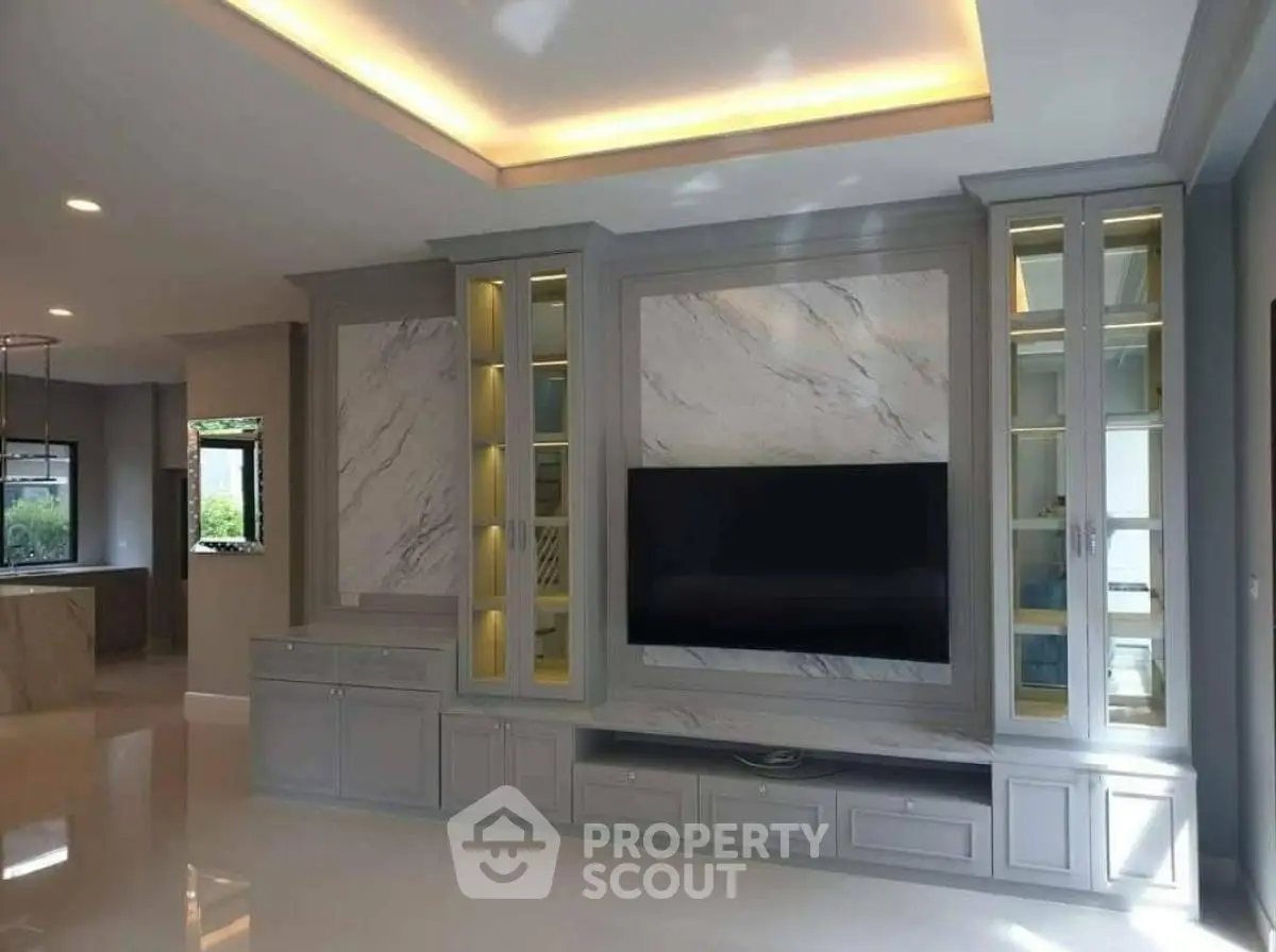 Luxurious living room with elegant built-in TV cabinet and ambient lighting