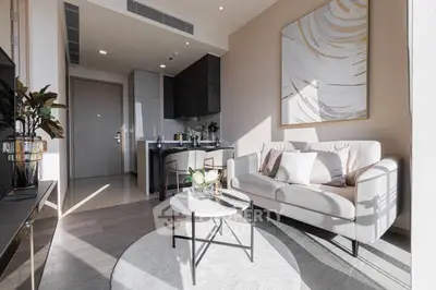 Modern living room with elegant decor and natural light in a stylish apartment.