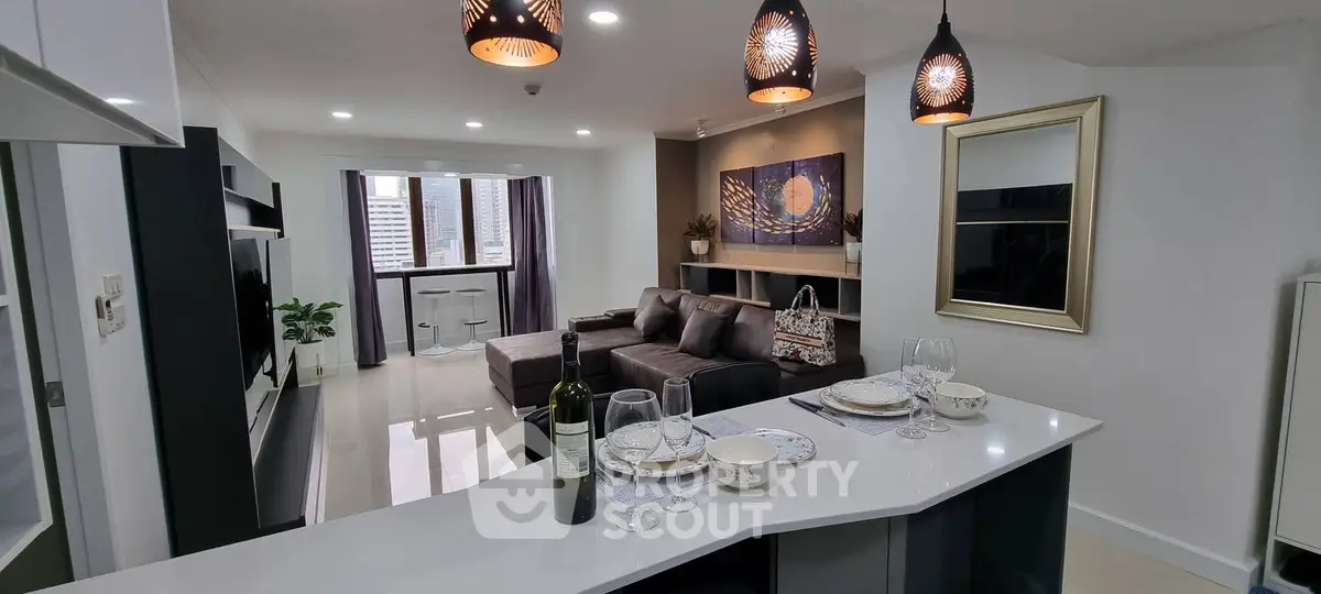 Modern open-layout living room with stylish decor and city view