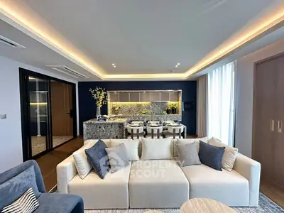 Luxurious modern living room with open kitchen and elegant decor