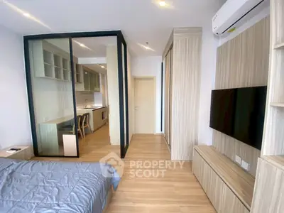 Modern studio apartment with open kitchen and sleek design