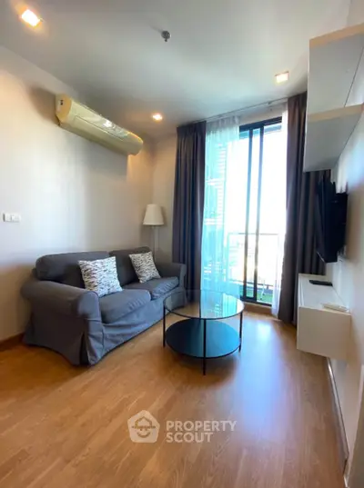 Cozy living room with modern decor and balcony view