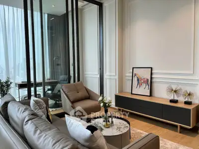 Luxurious modern living room with elegant decor and stylish furniture, featuring a cozy seating area and artistic accents.