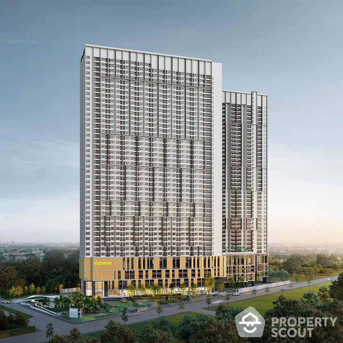 Modern high-rise building with sleek design and lush surroundings, ideal for urban living.