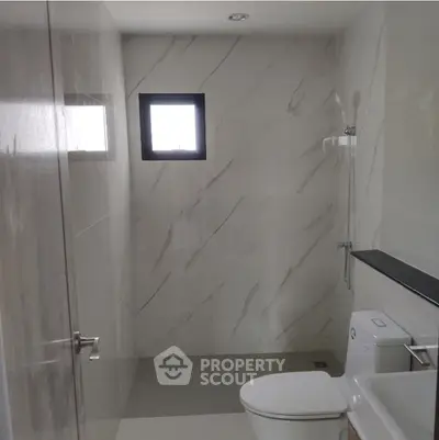 Modern bathroom with sleek design and marble walls