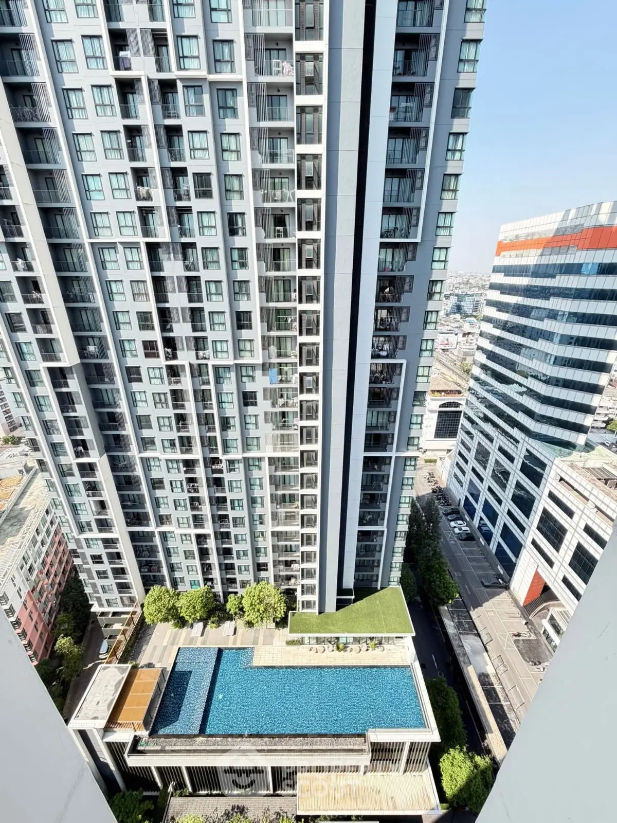 Stunning high-rise building with rooftop pool and city view