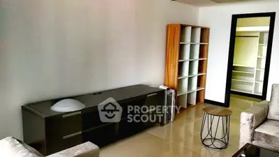 Spacious living room with modern furniture and sleek tile flooring