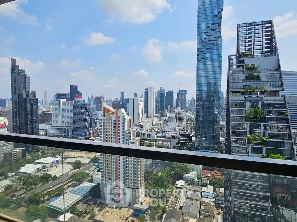 Stunning cityscape view from a high-rise balcony showcasing modern skyscrapers and urban landscape.