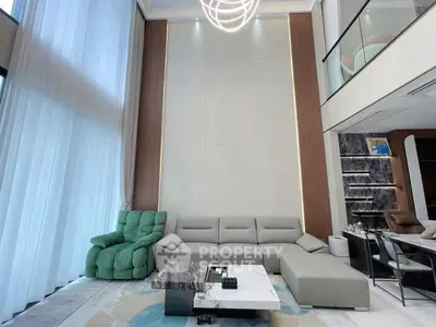 Luxurious modern living room with high ceilings and elegant furniture
