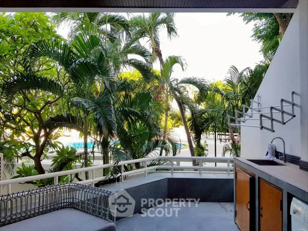 Luxurious outdoor patio with lush greenery and modern amenities