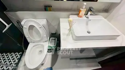 Modern bathroom with sleek fixtures and stylish tile flooring