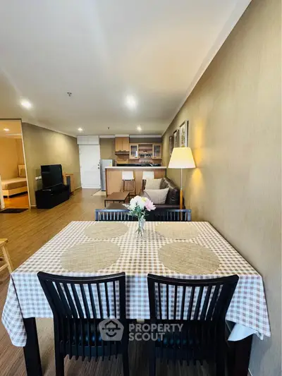Spacious open-plan living and dining area with modern decor and cozy ambiance.