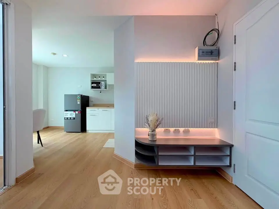 Modern open-plan living space with sleek kitchen and stylish decor
