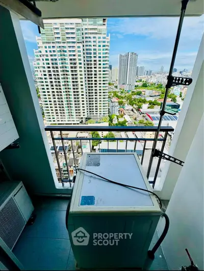 High-rise apartment balcony with washing machine and stunning city view