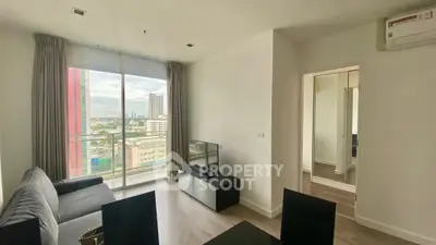 Modern living room with city view and sleek furniture in high-rise apartment