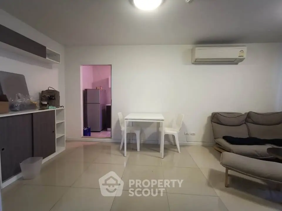 Modern living room with minimalist furniture and air conditioning