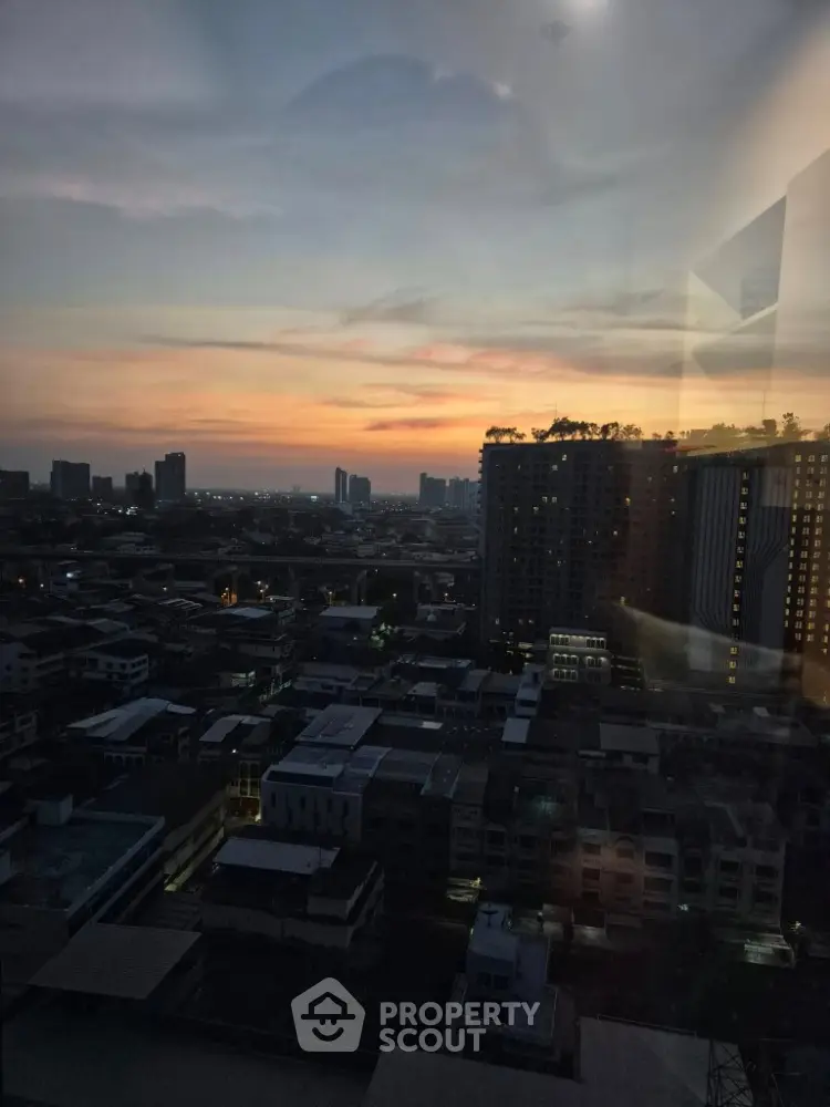 Stunning cityscape view at sunset from high-rise building window