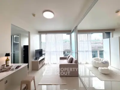 Bright and modern living room with large windows and stylish furniture