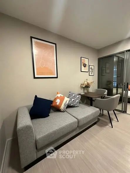 Modern living room with stylish decor and cozy seating area.