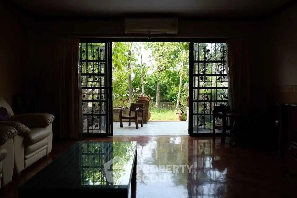 Spacious living room with garden view and elegant decor