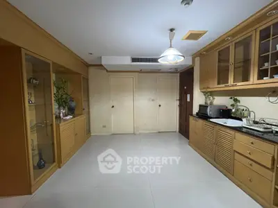 Spacious kitchen with wooden cabinets and modern appliances