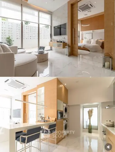 Luxurious open-plan living room and kitchen with modern design and elegant furnishings.