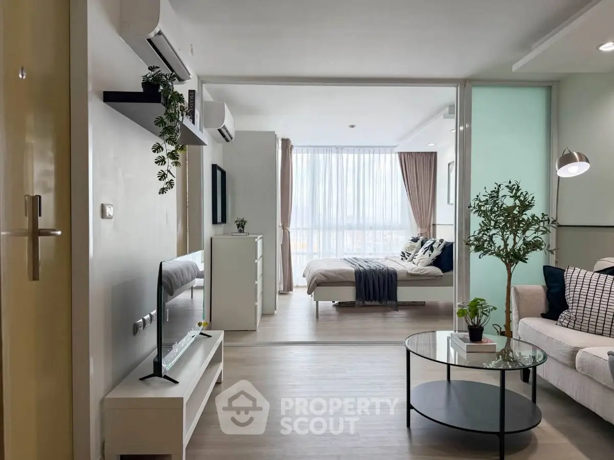 Modern open-plan living room with stylish decor and natural light