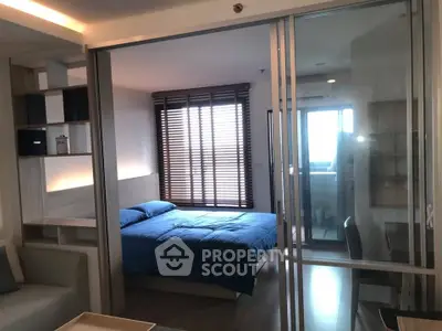 Modern bedroom with sliding glass doors and natural light