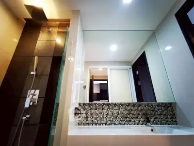 Modern bathroom with sleek design and mosaic tile accents
