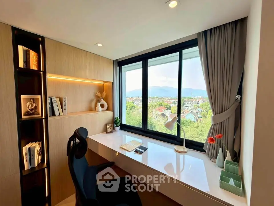 Modern study room with scenic view, sleek desk, and stylish shelving in a high-rise apartment.