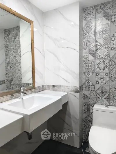 Modern bathroom with stylish tile design and sleek fixtures