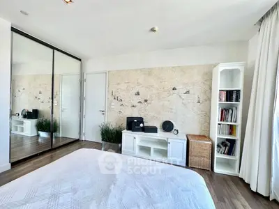 Spacious bedroom with stylish decor and ample storage space