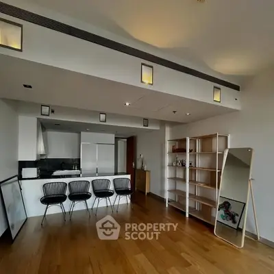 Spacious modern living room with open kitchen and stylish decor