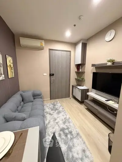 Cozy modern living room with plush sofa and stylish decor