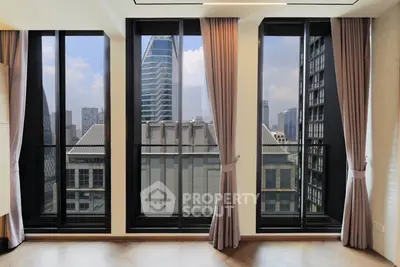 Luxurious high-rise apartment with floor-to-ceiling windows offering stunning city views.