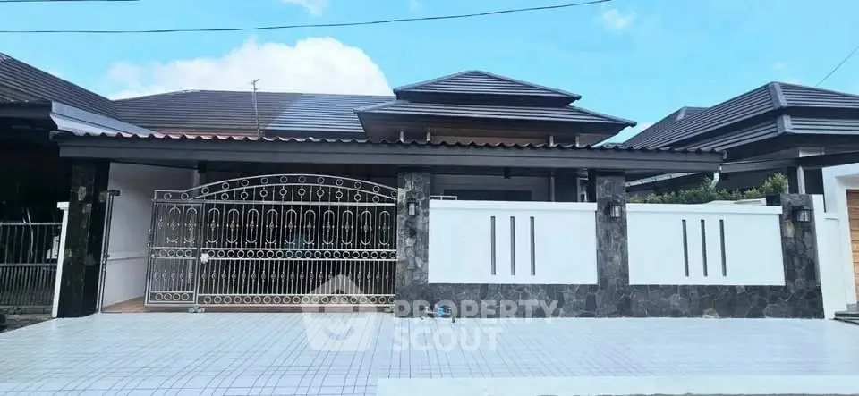 Elegant single-story home with modern design and spacious driveway