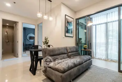 Modern living room with stylish decor and large windows for natural light