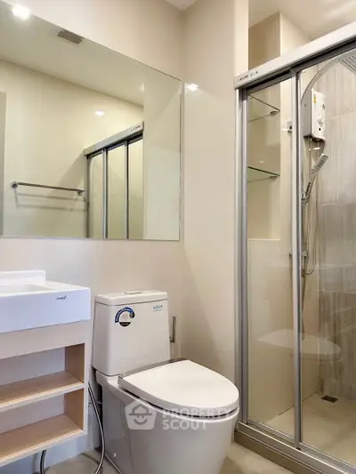 Modern bathroom with glass shower and sleek fixtures