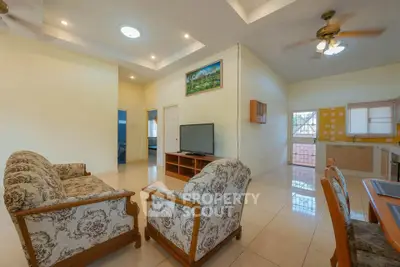 Spacious living room with elegant furniture and open kitchen layout